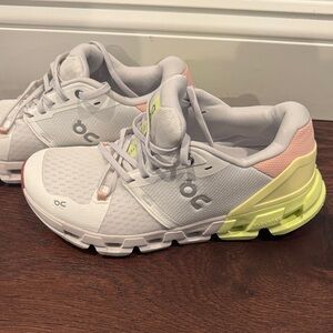 On Running cloud flyer White Sneakers with Yellow and Pink Accents